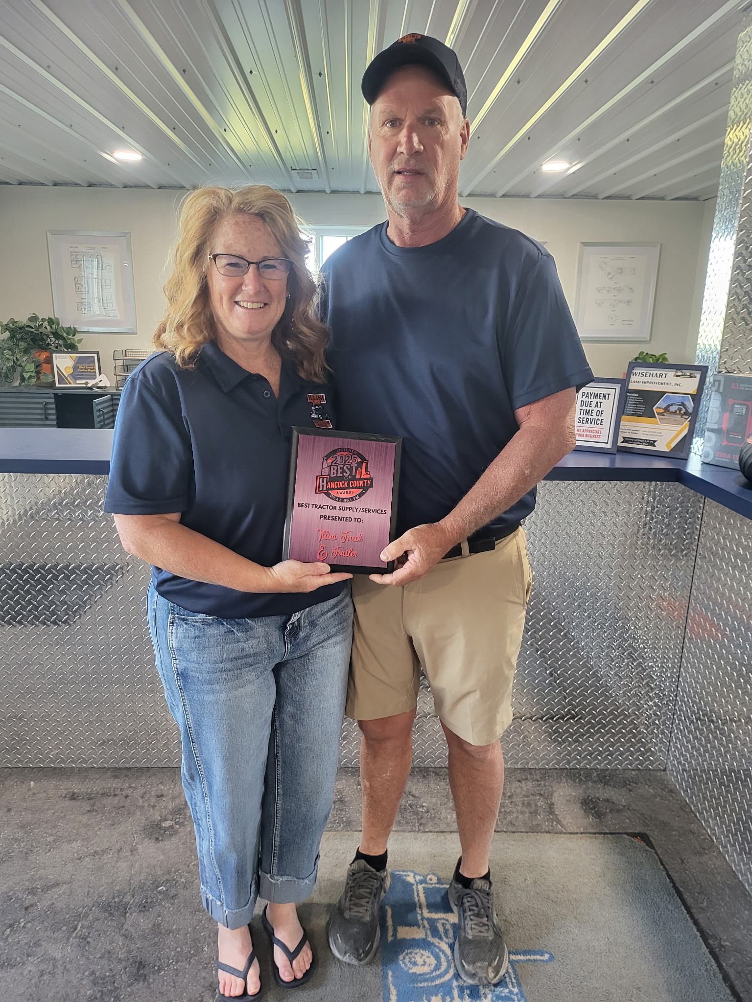 Rick and Chris Wisehart, owners of Illini Truck & Trailer Repair, with their Carthage Area Chamber of Commerce membership certificate